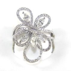 This Is A Fine Marquise Diamond Cluster Flower Curve Fashion Ring. It Is Made Of 100% Natural 14kt White Gold With A White Gold And Is In Brand New Condition. It Has A Ctw Of 1.98ct And Weighs 5.4 Grams. The Fancy Diamonds Have A Clarity Of Si1 And F Color. This Beautiful Custom Piece Has Excellent Marquise Cut Diamond Stones That Form Into A Cluster Around This Fashion Shaped Cocktail Ring. Samson Diamond Gia Certified Marquise Cut White Jewelry, Gia Certified White Marquise Cut Jewelry, White Gia Certified Marquise Cut Jewelry, White Marquise Cut Gia Certified Diamond Ring, White Marquise 14k White Gold Rings, Dazzling Marquise Cut White Diamond Ring, Gia Certified Marquise White Gold Diamond Ring, White Pear-shaped Ring With Single Cut Diamonds, White Platinum Marquise Diamond Ring