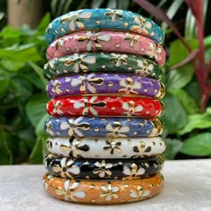 Choose from a set of three colors that we matched just for you. Black/White/Gold, Purple/Red/Blue or Pink/Teal/Green. Nothing showcases our islands beautiful colors more than these tropical colors. Bright and vibrant and unique to the islands these stylish bangles go with anything! The bangles have a hinged opening so they are easy to slip on and off. Wear them separately or all together. Keep them for yourself or give them to friends! Individually wrapped in a matching organza bag! If you pick Stylish Bangles, Tiare Flower, Blue Or Pink, The Bangles, Blouse Neck, Bangles Jewelry Designs, Tropical Colors, Red And Teal, Stacked Jewelry