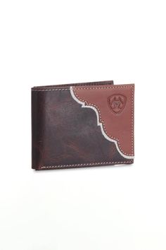 We know you need a new wallet and we have the perfect one for you! This Ariat Bifold Twotone Wallet in Brown/Multi has multiple card slots, twotone brown color, and top grain leather exterior for a very sleek look. Throw out that old wallet and get your hands our one of our new favorite accessories! Features of Ariat Bifold Twotone Wallet in Brown/Multi A3547908-BROWNMULTI: Ariat Style: A3547908-BROWNMULTI Color: Brown Multi Top grain leather interior/exterior Bifold Multiple credit card slots Twotone brown color Heavy duty stitching Slim fit design Horizontal inner slot Ariat logo on exterior Brown Bifold Card Holder With Coin Pocket, Vintage Brown Bifold Wallet With Coin Pocket, Vintage Brown Bifold Wallets With Card Slots, Vintage Brown Bifold Wallet With Card Slots, Brown Rectangular Trifold Wallet With Coin Pocket, Vintage Brown Bifold Wallet With Interior Card Slots, Brown Bifold Card Holder For Formal Use, Formal Brown Bifold Card Holder, Brown Bifold Wallet With Rfid Blocking