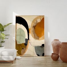 an abstract painting on the wall next to two vases and a chair in a room