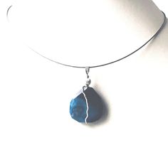 When I create pendants I use beautiful semi-precious gems like agate, jasper, onyx, lapis, turquoise, quartz and so many other unique gems. This is a beautiful plum blossom agate or blue Sakura agate that gives the appearance of blossoms deep in the gemstone. It's a deep rich blue which contrasts nicely with the sterling silver.   A simple sterling silver wire wrap enhances the natural markings within the stone and forms a bail  that is big enough to accommodate a larger chain or cord. This makes it a very versatile piece of jewelry. A long cord looks great with a tunic.     The 18 inch neck wire included with your purchase. A pendant is perfect when you want your jewelry to be seen but don't want to wear a larger necklace. My pendants are striking so please check the measurements! Crystal Adjustable Moss Agate Gemstone Jewelry, Agate Teardrop Pendant With Natural Stones, Agate Teardrop Pendant Jewelry With Natural Stones, Agate Gemstone Teardrop Pendant Jewelry, Agate Natural Stones Teardrop Pendant Jewelry, Teardrop Pendant Agate Jewelry With Natural Stones, Blue Agate Pendant Jewelry, Turquoise Agate Teardrop Jewelry, Turquoise Teardrop Agate Jewelry