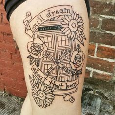 a woman with a tattoo on her thigh that reads, you're the dream