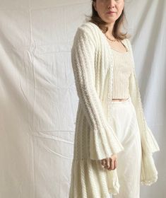 "Vintage super rare long knit cardigan in white colour No closure and tight the sleeves Condition: Quite good Composition: No label tag. But most possibly a wool blend Size: It will fit into EU/XSmall or 6-8 UK / 2-4 US sizes depending on the desired fit Please check the measurements.  Measurements :  Bust circumference: 80 cm (31.5\") Sleeve length: 71 cm (28\") Total length: 96 cm (38\") Model's size: 38 EU / 10 UK / 6 US (a bit tight) *Please concentrate on measurements, instead of size tags White Long Sleeve Soft Knit Sweater Coat, White Soft Knit Long Sleeve Sweater Coat, White Soft Knit Sweater Coat, Long White Soft Knit Sweater, White Long Soft Knit Sweater, White Cozy Long Sleeve Cardigan, White Knitted Long Sleeve Sweater Coat, Long Cream Sweater Coat For Layering, Cozy White Long Sleeve Cardigan