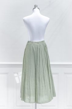 Perfect for your autumnal wardrobe, this breezy midi skirt in pleated sage green chiffon features a smocked elastic waistline and a-line silhouette made for twirling! . Details: S: Waist 26"-30", Length 32" M: Waist 28"-32", Length 32.5" L: Waist 30"-34", Length 33" Elastic Waistline Lined Material: 100% Polyester Care: Gentle Wash Cold / Hang Dry Imported Ships in 1 to 2 Business Days Free US Shipping on Orders over $100 Breezy Flowy Maxi Skirt With Elastic Waistband, Spring Breezy Gathered Maxi Skirt, Spring Pleated Flowy Maxi Skirt, Spring Breezy Flared Maxi Skirt, Flowy Long Pleated Skirt, Spring Full Maxi Skirt With Elastic Waistband, Breezy Flared Maxi Skirt For Spring, Breezy Flowy Skirt With Elastic Waistband, Breezy Skirt With Elastic Waistband