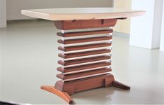 a wooden table that has been made to look like it is stacked on top of each other