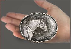 American Quarter Horse western belt buckle in mirror polished pewter is 3.5 X 2.75 inches with 1 .75 inch belt loop. Designed and handmade by the artist, USA. Sculptured horse head on a western patterned background with rope trim. Horse Western, Patterned Background, American Quarter Horse, Western Belt Buckles, Western Belt, Western Belts, Quarter Horse, Horse Head, Belt Buckle