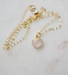 Looking for a unique accessory for some self love, or love for that special someone? Crafted from 14k gold filled and natural Rose Quartz, this pendant is the perfect, sparkling way to show anyone how much you care. Rose Quartz is a stone of love. It is believed to restore trust & harmony in relationships and encourage unconditional love. It purifies the heart and promotes self love, inner healing, and friendship. It is an alternate birthstone for January, as well as the spiritual birthstone for Feminine Round Pendant Jewelry Gift, Rose Gold Heart Pendant Necklace Gift For Her, Rose Gold Heart Pendant Necklace For Her, Minimalist Rose Gold Heart Cut Jewelry, Rose Gold Plated Charm Necklaces With Heart Charm, Rose Gold Plated Heart Charm Necklaces, Rose Gold Plated Charm Necklace With Heart Charm, Rose Gold Heart Charm Necklace, Gold Plated, 14k Gold Filled Birthstone Jewelry Gift For Her