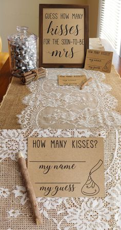 a table topped with lots of different types of signs and papers on top of it