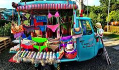 an ice cream truck is decorated with colorful items