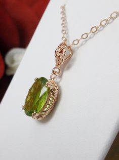 Natural Green Peridot Pendant Necklace, green peridot pendant, with a natural green peridot oval stone set in floral rose gold filigree, 4 prongs hold the gem in place, Silver Embrace Jewelry Luxury Peridot Jewelry For Gifts, Elegant Peridot Jewelry For May Birthstone, Elegant Formal Necklace With Peridot, Elegant Peridot Necklaces For Wedding, Elegant Peridot Necklace For Gift, Edwardian Necklace, Antique Filigree, Peridot Jewelry, Peridot Pendant