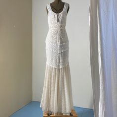 a white dress on display in a room