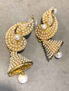 Traditional Bollywood Statement Earrings, Glamorous Indian Pearl Wedding Bell Dangles These beautiful Hollywood Regency /Bollywood Style are both Ornate and at 7mm long - make an elegant statement too! They are perfect for the holiday season- romantic and festive - and would Look lovely ringing in the New Year on New Years Eve! And Pearl is super trending, too!! If you are getting married they compliment a number of styles from Boho Glam to tribal & yoga inspired themes to more traditional v White Jhumkas With Intricate Design For Reception, White Jhumkas For Reception And Festivals, White Jhumkas For Diwali Reception, Reception White Jhumkas With Intricate Design, White Pearl Drop Earrings For Reception, White Danglers With Intricate Design For Reception, Elegant Dangle Jhumkas For Reception, White Bridal Earrings With Latkans For Wedding, Festive Pearl Drop Danglers For Reception