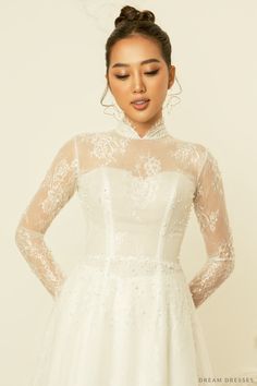 Our sweet and stylish Calixta white bridal ao dai is the perfect ensemble for modern brides who love a whimsy, girly aesthetic. Calixta features a flare A-line bottom, sheer, couture French lace detailing, silk pants, and a classic high collar. This gorgeous, romantic ao dai is the ideal fusion of traditional and modern elements. Feel unique, classy, and elegant in Calixta! Detail: White Vietnamese Ao Dai Collar: 1.2''/3cm Long sleeves Bra cups added Zipper closure Flare A-line bottom Floor len Sheer Couture, Bridal Ao Dai, Ao Dai Modern, Vietnamese Ao Dai, Girly Aesthetic, Dream Dresses, Modern Elements, Bridal Robes, Silk Pants