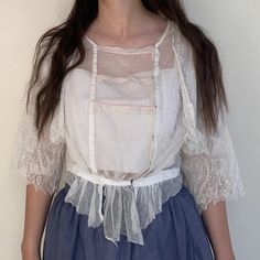 "Antique sheer Edwardian blouse. Made from netting and lace with a gathered waist. Front closure. Size Estimate: Small Measurements  Bust: 40\" / Waist: 28\" / Length: 21\" / Shoulders: 16\" Condition Two small mends on back sleeves and a few small holes in netting as shown. Great condition for age and wearable with care. Follow @willavintage on Instagram --------------------------------------------------------------------------------------- All items are vintage and most are pre-worn. Imperfect Fitted Lace Mesh Top With Lace Trim, White Lace Top With Sheer Sleeves, Fitted Lace Top With Lace Sleeves For Daywear, Sheer Lace Short Sleeve Top, Sheer Fitted Blouse For Daywear, Fitted Sheer Blouse For Daywear, Sheer Blouse For Daywear, Feminine Sheer Sleeves Top For Daywear, Feminine Lace Top With Lace Sleeves For Daywear