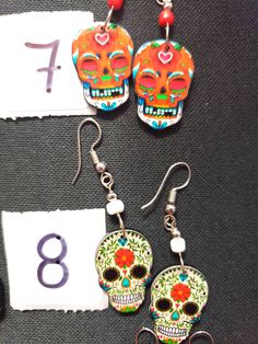 HANDMADE SUGAR SUGAR EARRINGS set 4 --choose from #1-9 and that exact one you will receive :) If you would like many please message us :) DETAIL IS AMAZING! NOT ONE IS THE SAME! COOLER IN PERSON! Set 4 Bohemian Skull Earrings For Gifts, Halloween Skull Jewelry With Skull Print, Nickel Free Skull Jewelry For Day Of The Dead, Nickel-free Skull Jewelry For Day Of The Dead, Day Of The Dead Skull Jewelry Gift, Handmade Earrings For Day Of The Dead, Handmade Skull Earrings For Halloween, Halloween Skull Jewelry With Ear Wire, Multicolor Skull Jewelry For Day Of The Dead