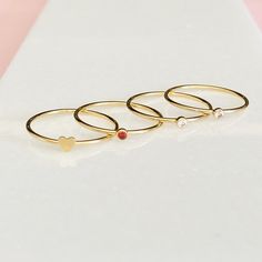 "Our gold filled Valentine's Day stacking rings are the perfect gift for a loved one. Choose from our 14kt gold filled Swarovski Crystal rings available in rose, red and diamond pair with a heart ring. The perfect stack to say I love you! DETAILS & SIZE *Swarovski Crystal Stone Options: Garnet, Diamond, Rose *Available in our high-quality 14kt gold-filled *Gemstone: 2 mm *Every purchase comes in a Tangerine branded gift box. *Handcrafted with care in Seattle WA *We LOVE what we create and wa Heart Ring Gold, Rings Heart, Swarovski Crystal Rings, Birthstone Rings, Gift Valentines Day, Gold Gift, Branded Gifts, Crystal Stone, Crystal Rings