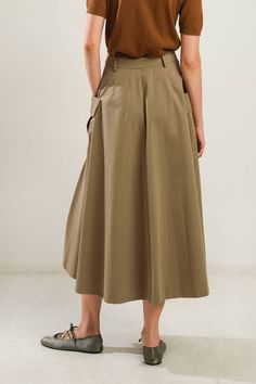 A solid woven full skirt featuring front closure and side pockets Details: Self : 100% Cotton Size & Fit - Model is 5`8" And Wearing Size Small- Measurements Taken From Size Small- Approx. Length: 33.5" Chic Long Cargo Skirt With Pockets, High Waist Brown Skirt With Pockets, Brown Cargo Skirt With Pockets For Spring, High Waist Solid Skirt With Side Pockets, Khaki Midi Skirt With Pockets, High Waist Beige Skirt With Pockets, Solid High Waist Skirt With Side Pockets, Khaki Skirt With Pockets, Solid Color Midi Skirt With Pockets