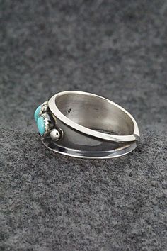 This turquoise and sterling silver ring was made by Navajo silversmith Paul Largo. The inside is stamped sterling.Size: 11.5Length: 3/8"Free shipping on all orders! We ship with USPS and always include tracking. All orders ship within a day of payment.Returns are accepted up to 30 days after you receive your order. Just send us a message. Our shop offers cash back or store credit. The item must be returned in new condition. Sterling Silver Turquoise Rings With Concho Detail, Sterling Silver Turquoise Ring With Concho, Native American Jewelry, Turquoise Sterling Silver, Free Jewelry, Sterling Silver Ring, Silver Ring, Sterling Silver Rings, Silver Rings