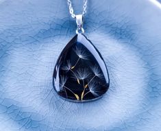 "Terrarium necklace - Dandelion seed - Resin jewelry - Nature locket - Gift for mom - Teardrop charm - Forest witch  Made with real dandelion seeds, resin stainless steel findings and chain. You will get the beautiful gift package with ribbon for free Size: Drop size is 0.98\" x 0.59\" (2.5 x 1.5 cm) chain length - 19.69\" (50 cm) PLEASE NOTE: *It's real plants , so with time they can change color REGULATIONS OF THE USE: *Resin jewelry must be kept separately from other jewelry (to avoid scratch Teardrop Jewelry Charms For Gifts, Teardrop Charms Jewelry Gift, Teardrop Charms Jewelry For Gifts, Teardrop Charm Jewelry Gift, Gift Teardrop Jewelry With Charms, Gift Drop Necklace With Charms, Teardrop Pendant Locket As Gift, Teardrop Pendant Locket For Gift, Teardrop Locket Jewelry As Gift