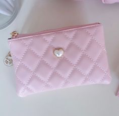 Beautiful pink vegan leather quilted pouch is the perfect accessory to hold all of your cards and information. Gold charm zipper details and pearl applique. Looks great paired with our Luxury pink quilted bag. Zipper Closure. Size: 6.5"W x 4"H Pink Card Holder, Purse Inspiration, Girl Wishlist, Pearl Applique, Quilted Pouch, Pink Wallet, Quilted Wallet, Pink Cards, Mini Pouches