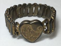 Vintage Gloria Heart Bracelet Sterling Base 1/20 10K Gold Filled Top shell | eBay Gold Stretch Bracelet, Heart Bracelet, 10k Gold, Stretch Bracelet, Stretch Bracelets, Antique Gold, Gold Filled, Shells, Old Things