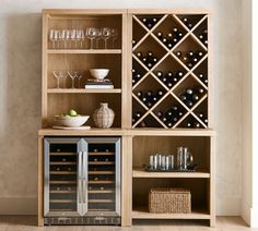 a wine rack with many bottles and glasses