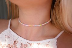 "Pastel rainbow African Heishi vinyl beaded choker necklace! Choker is 13 inches with a 2\" adjustable extender chain (15 inches full length) Custom sizes are available upon request! Contact me through Etsy messages. Handmade with love by Amanda Matching anklet/bracelet can be found here: https://etsy.me/3g5WX82 **please read my shop's policies** Thanks for viewing! ❤️" Beautiful Chokers, Handmade Chokers, Handmade Gift Tags, Cotton Drawstring Bags, Beaded Choker Necklace, Anklet Bracelet, Heishi Beads, Beach Jewelry, Beaded Choker