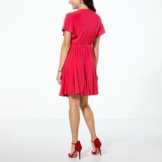 Nina Leonard Belted Godet Hem Dress  Stay the stylish course with this flattering belted dress from Nina Leonard. The flirty godet skirt creates an outstanding look that others won't soon forget.