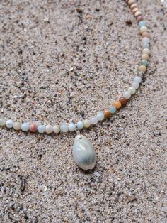 Originally founded as an arts colony, Laguna Beach is a mix of chill beach town and funky bohemian culture, offering some of the clearest blue water and the most relaxing days Southern California has to offer. MATERIALS blue and natural colored Amazonite with cowrie shell and natural wood on a 15" wire, finished with a 1.5" sterling silver extender chain with a ring clasp and tulip shell. Every stone is unique, which means that each bracelet is too. You can expect your jewelry to be one of a kin Bohemian Culture, Clear Blue Water, Beach Necklaces, Cowrie Shell, Relaxing Day, Beach Town, Laguna Beach, Summer Jewelry, Blue Water