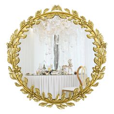 a table with white and gold decorations on it