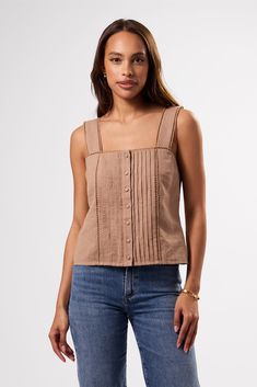 The perfect summer top, light and breezy with delicate crochet detailing, reminiscent of treasures found in a Parisian Flea Market. Square-neck tank top with crochet trim, pleat details, and fabric-covered buttons on front placket21 1/2" in Length52% Linen 48% Organic CottonStyle hit just above hips, can be worn tucked-in or looseEthically Made in India Crochet Trim Shirt, Cotton Crochet Trim Tank Top, Cotton Tank Tops With Crochet Trim, Chic Crochet Trim Tank Top For Day Out, Casual Summer Crochet Top With Buttons, Bohemian Sleeveless Buttoned Top, Sleeveless Spring Blouse With Crochet Trim, Sleeveless Blouse With Crochet Trim, Delicate Crochet