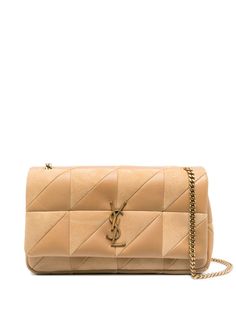 Find SAINT LAURENT Jamie Shoulder Bag on Editorialist. The Saint Laurent Jamie shoulder bag is crafted from lambskin with a quilted finish. The bag features a monogram plaque, gold-tone hardware, and a foldover top with a magnetic fastening. It has a leather and chain-link shoulder strap and an internal zip-fastening pocket. The bag can be worn on the shoulder or crossbody. Luxury Purses, Demi Fine Jewelry, Boot Pumps, Designer Shoulder Bags, Quilted Leather, Clothing Ideas, New Season, Sales Gifts, Shoulder Bag Women