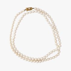 This is a truly exceptional piece - an genuine vintage MIKIMOTO Japanese Akoya pearl necklace with an 18K yellow gold pearl clasp, adorned with the renowned Mikimoto trademark. The necklace is a classic, timeless design that is sure to be treasured for generations to come. Measuring 32" (81cm) in length and weighing 47.8 g, the necklace is made up of high-quality cultured Akoya pearls farmed in Japan. The pearls are 7.0 to 7.5 mm in size and exhibit a stunning white color with pink and green overtones. The luster is exceptional, reflecting the unparalleled quality of Mikimoto pearls. The pearls are round in shape and have a surface that is very clean with only a few natural inclusions - a testament to their genuineness and quality. As an added bonus, the necklace comes with a vintage Mikim Luxury Double Strand Pearl Necklace For Formal Occasions, Luxury Double Strand Pearl Necklace, Formal Double Strand Pearl Necklace With Pendant, Formal Vintage Akoya Pearl Necklace, Fine Jewelry Akoya Pearl Necklace With 17 Jewels, Classic Round Pearl Necklace With 17 Jewels, Classic Jewelry With Sterling Silver Clasp, Formal Yellow Gold Pearl Necklace, Vintage Akoya Pearl Necklace For Formal Occasions