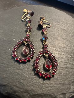 "Elegant long screw back Garnet Bohemian dangle earrings.  Condition I see no problems any slight wear commensurate with age-photos show the details.  Length approx. 2 \", wt.- 5.2 grams.  Well designed in the early 1900s in Europe-the rich red color given by nature is wonderful to behold.  Great antique earrings that transport the viewer and wearer to visual splendor." Victorian Screw Back Earrings For Wedding, Victorian Screw Back Wedding Earrings, Victorian Wedding Earrings With Screw Back, Victorian Chandelier Dangle Earrings For Formal Occasions, Antique Dangle Plug Earrings, Victorian Evening Earrings With 17 Jewels, Antique Dangle Chandelier Earrings For Formal Occasions, Antique Clip-on Earrings For Evening, Antique Formal Dangle Chandelier Earrings