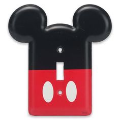 a mickey mouse light switch cover is shown in black and red with white dots on it