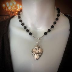 Large (1.75 inches) silver toned Sacred Heart pendant on a black  glass rosary style chain.  Back lobster clasp. Rosary Necklace, Sacred Heart, Black Glass, Rosary, Heart Pendant, Pendant Necklaces, Lobster Clasp, Necklace Etsy, Jewelry Necklace Pendant