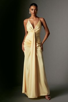 Embrace an unforgettable sophistication with our Ock Deep V Halter Satin Maxi Dress! Crafted from luxurious satin fabric, this dress features a chic deep V-neckline and a halter design, complemented by a striking thigh-high split that adds a bold and flirtatious touch. To complete your look, pair it with simple gold jewelry and elegant high heels to accentuate its sophisticated charm.    Model wearing size S  Model Stats:Height - 68.9”/175 cm Bust - 34.6”/88cm Hips - 36.2”/92 c Satin V-neck Evening Dress For Gala, Chic Satin Finish V-neck Evening Dress, Chic Satin Dress With Fitted Bodice And V-neck, Prom Satin V-neck Dress With Bias Cut, Silk Satin V-neck Dress With Fitted Bodice, Ruched V-neck Satin Dress For Formal Occasions, V-neck Bias Cut Evening Dress For Prom, Satin V-neck Evening Dress For Prom, V-neck Satin Dress For Gala