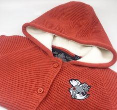 Cookie empire kids Knitwear red coral Sherpa hooded Cardigan with kids logo left chest cotton soft knit close up of cotton fibres logo and label Textile Designs