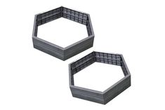 two hexagonal trays sitting side by side on a white surface, each with an opening at the top