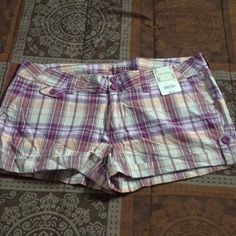 Purple/Soft Orange/White Plaid Shorts Waist Is 19" Wide Shorts Are 11" Long 2.5" Inseam Purple Cotton Shorts With Pockets, Purple Cotton Bottoms Short Length, Purple Cotton Short Bottoms, Casual Purple Cotton Shorts, Summer Cotton Bottoms In Purple, Summer Cotton Purple Bottoms, Purple Cotton Summer Bottoms, Summer Purple Cotton Bottoms, Purple Fitted Cotton Shorts