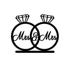 two wedding rings with the word mr and mrs written on them in cursive font