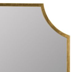 an ornate gold framed mirror against a white background