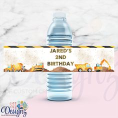 a water bottle label with construction trucks on it and the words, jard's 2nd birthday