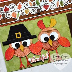 a close up of a thanksgiving card with two turkeys wearing hats and holding leaves