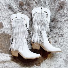 These fashionable, studded cowboy boots will make you stand out in the crowd! The grey fringe adds a unique touch that will turn heads wherever you go. Step into these stylish under-knee boots and express your bold personality. Western Boots With Rhinestone Fringe For Fall, Western Rhinestone Fringe Boots For Fall, Western Boots With Rhinestone Fringe And Round Toe, Western Fringe Boots For Fall, Western Style Knee-high Boots For Fall Festivals, Spring Boots With Rhinestone Fringe, Western Style Fringe Boots For Spring, Studded Cowboy Boots, Fringe Cowboy Boots