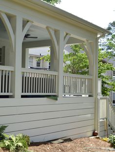 a white house with an attached porch