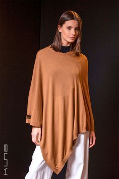 Beautiful and amazingly soft-knitted poncho made from 100% Vicuna. The ultimate in understated luxury. Vicuna is the finest animal fiber in the world. Luxurious Vicuna is extremely light, amazingly soft, and provides unrivaled warmth. This poncho comes in a wooden box and includes a hand-numbered and signed card guaranteeing the fiber came from government-controlled shearing operations. Vicunas may only be sheared every two years and produce a small amount of fiber, increasing the rarity of this Womens Sweater Coats, Alpaca Shawl, Alpaca Coat, Capes & Ponchos, Dark Academia Fashion, Nat King Cole, Alpaca Scarf, Academia Fashion, King Cole