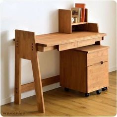 a wooden desk with two drawers and a book shelf