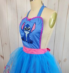 a dress made to look like an elephant with pink and blue trims on it