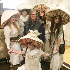 a group of women dressed in costume posing for a photo